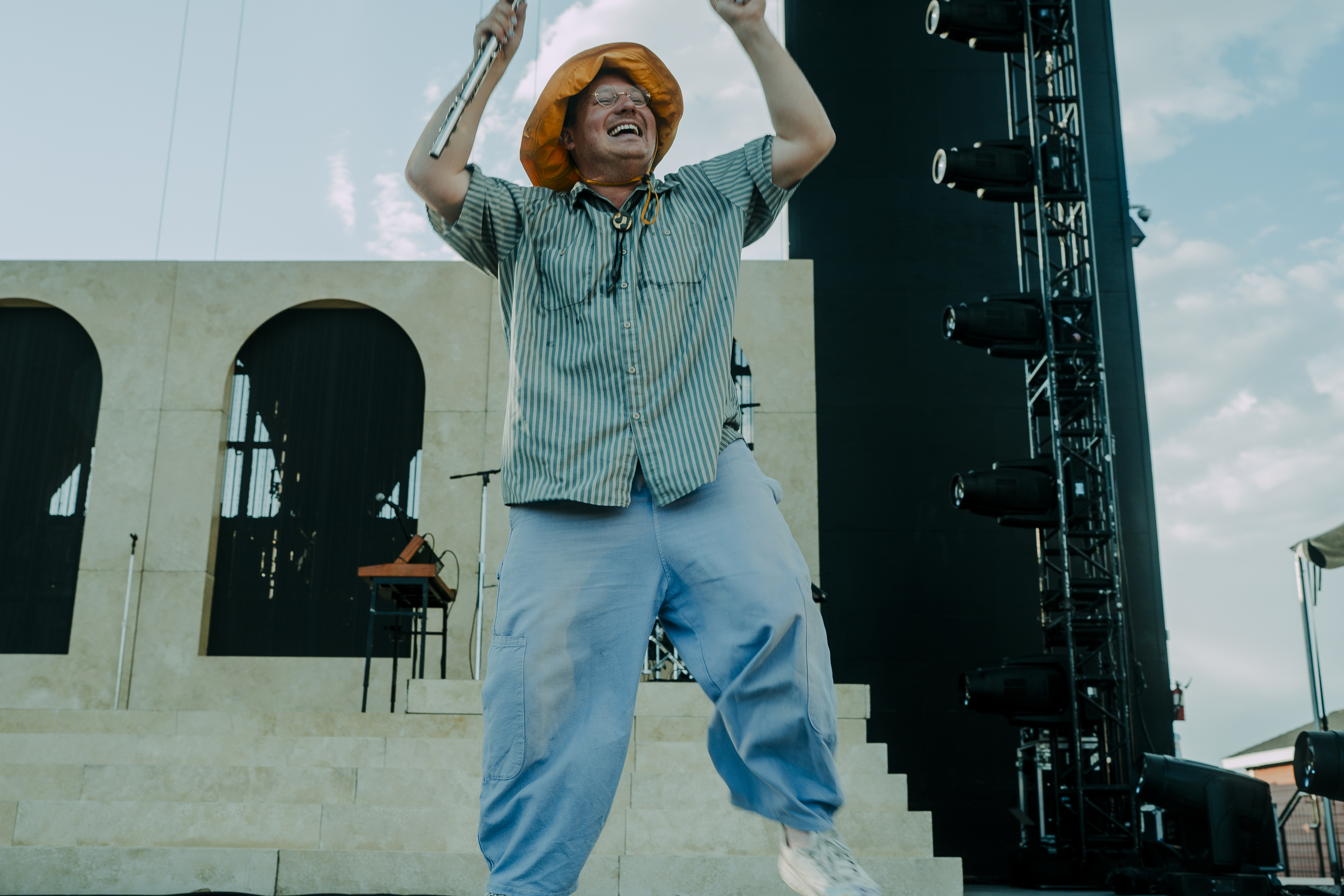 Logan Hone performing exuberantly onstage